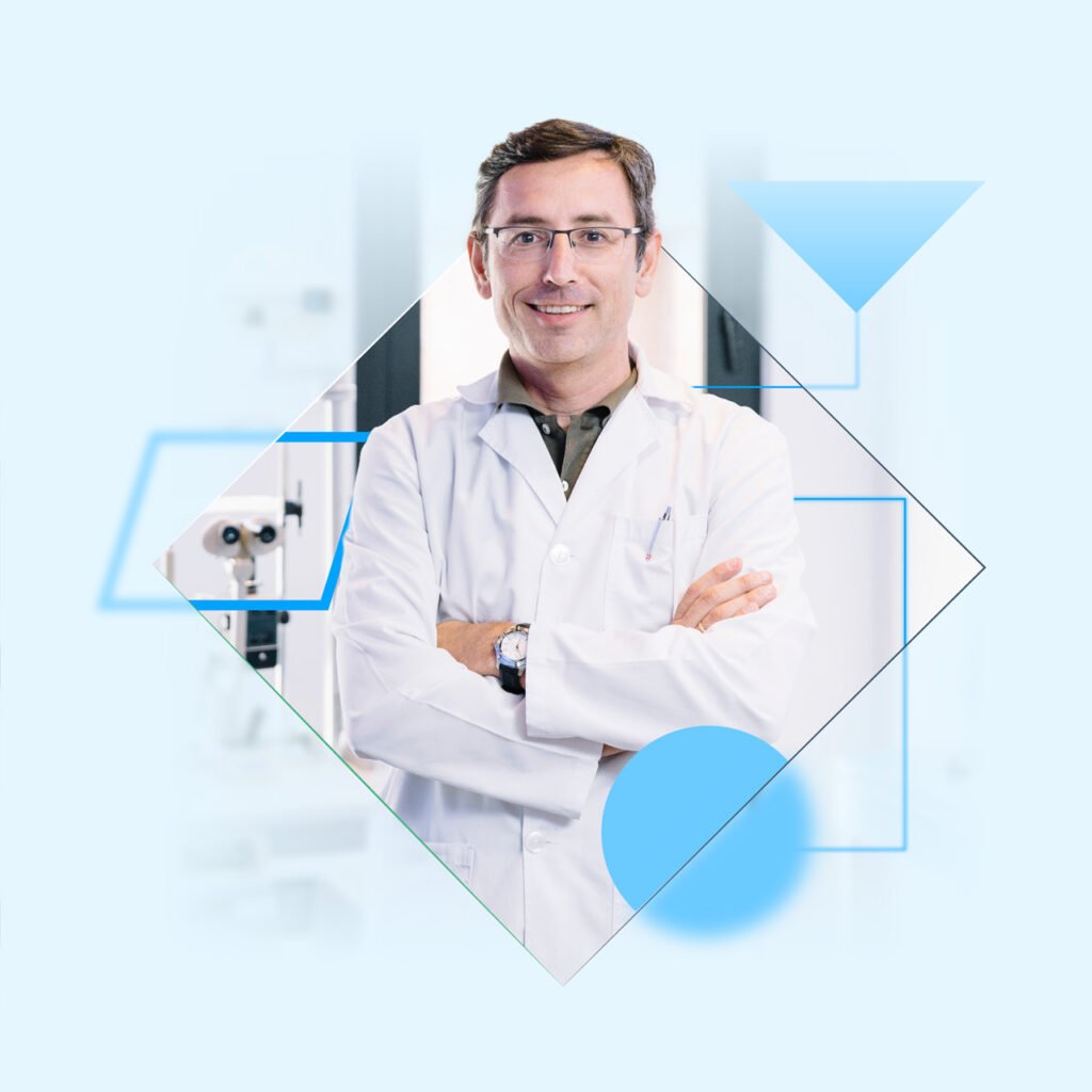 Male optometrist standing in a lab coat with folded arms